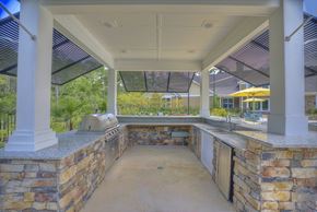 Tallahassee apartment for rent - Poolside kitchen with grill and bar at Lullwater at Blair Stone apartments for rent