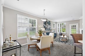 Pikesville apartment for rent - A dining room with a glass table and chairs.