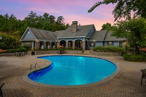 Canton apartment for rent - Heritage at Riverstone clubhouse and swimming pool at sunset in Canton, GA