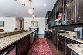 Macon apartment for rent - Communal kitchen with bar-style seating at Riverstone apartments for rent in Macon, GA