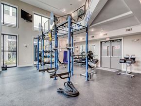 Ladson apartment for rent - a gym with weights and cardio equipment in a building with glass doors