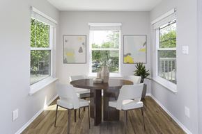 Woodbridge apartment for rent - Renovated unit dining area with wood-designed flooring at  Springwoods at Lake Ridge