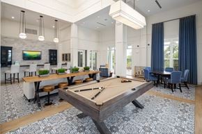 Augusta apartment for rent - Resident clubhouse with billiard table and seating areas at The Highland in Augusta, GA