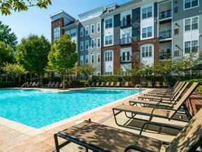 Rockville apartment for rent - a swimming pool in front of an apartment building