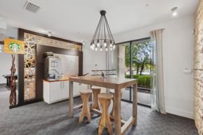 Orlando apartment for rent - A dining area with a wooden table and chairs.