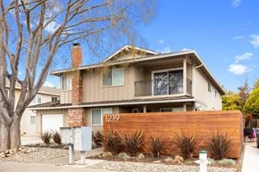 Sunnyvale apartment for rent - A house with the number 1219 on the fence.