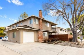 Sunnyvale apartment for rent - A house with a white garage door and a brown roof.
