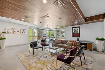 Los Angeles apartment for rent - A living room with a glass table and chairs.