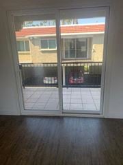 Camarillo apartment for rent - a sliding glass door in a living room looking out onto a balcony