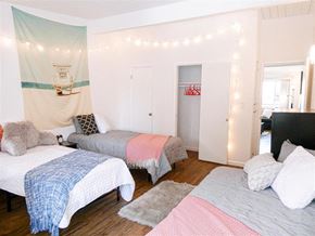 Goleta apartment for rent - A bedroom with two beds and a canopy bed.