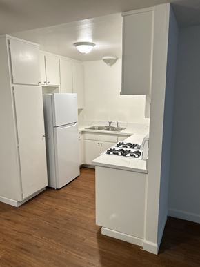 Ventura apartment for rent - A small kitchen with a sink, stove and refrigerator.