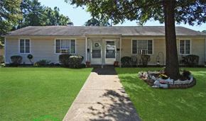 Charlotte apartment for rent - a white house with a lawn and a tree
