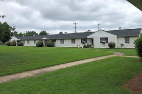 Charlotte apartment for rent - a white house with a lawn in front of it