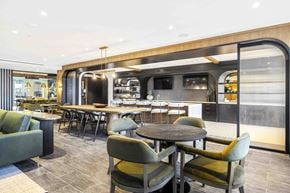 Clifton apartment for rent - A modern dining area with a long table and chairs.