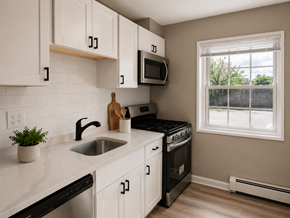Madison apartment for rent - A kitchen with white cabinets and black countertops.