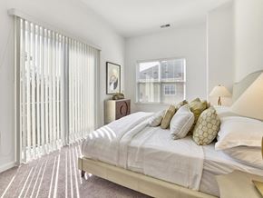 Iselin apartment for rent - a bedroom with a large bed and a large window