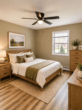 Madison apartment for rent - A bedroom with a bed, nightstands, and a ceiling fan.