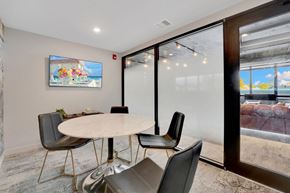 Bayonne apartment for rent - Conference room with round table and frosted glass partition at Bay One Apartments, New Jersey
