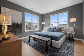 Warren apartment for rent - Modern bedroom with gray walls and large windows at Aster Grove Apartments, Warren, New Jersey