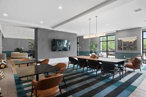 Warren apartment for rent - Clubhouse dining area with striped rug and pendant lighting at Aster Grove Apartments, Warren, 07059