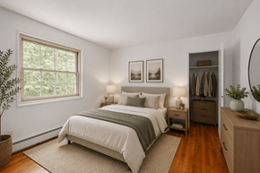 Madison apartment for rent - A bedroom with a large bed and a wooden dresser.