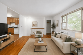 Madison apartment for rent - A living room with a couch, a coffee table, and a television.