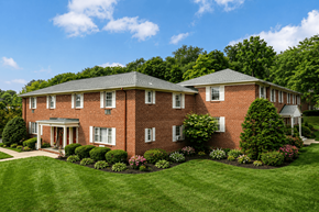 Madison apartment for rent - A large red brick house with a white door and windows.