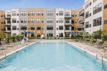 Clifton apartment for rent - A swimming pool in front of apartment buildings.