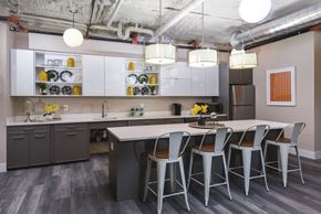 Iselin apartment for rent - a kitchen with a long island with chairs and a table