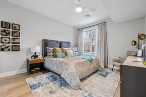 Verona apartment for rent - Bedroom with upholstered headboard and decorative pillows at Highlands at Hilltop Apartments, Verona, New Jersey