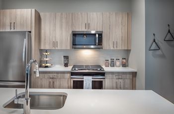 Quartz countertops and tile backsplashes