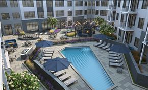 Hackensack apartment for rent - an aerial view of a swimming pool in front of an apartment building