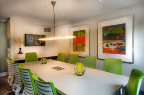 Weehawken apartment for rent - Conference room with colorful modern chairs and artwork at RiverParc Apartments, New Jersey, 07086