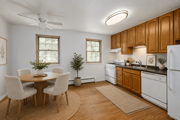 Madison apartment for rent - A kitchen with a table and chairs in the middle of the room.
