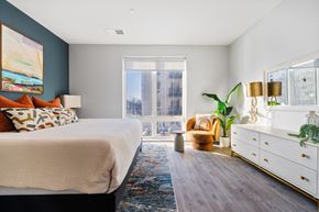Allendale apartment for rent - a bedroom with a bed and a large window