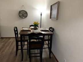 Wyoming apartment for rent - a dining room with a wooden table and chairs
