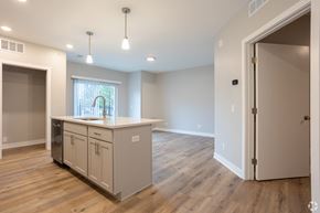 Grand Rapids apartment for rent - A kitchen with a window and wooden floors.