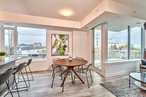 Ottawa apartment for rent - a dining room with a table and chairs and a large window
