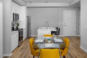 West Kelowna apartment for rent - a kitchen and dining area in a 555 waverly unit