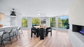 Colwood apartment for rent - A modern dining room with a wooden table and chairs.