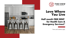 Kamloops apartment for rent - A modern kitchen with a red and white advertisement for The View Apartments offering half month free rent for health care and emergency services.
