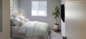 Las Vegas apartment for rent - a bedroom with a bed and a window at Silver Creek Apartments, Las Vegas, Nevada