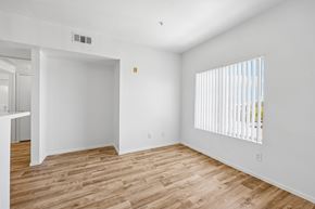 Las Vegas apartment for rent - A room with wooden flooring and white walls.