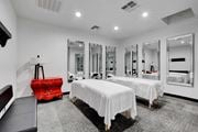 Las Vegas apartment for rent - two beds in a room with mirrors and a red suitcase at Evoq Apartment Homes, Las Vegas  
