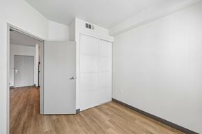 Las Vegas apartment for rent - A white door is in a room with wood flooring.