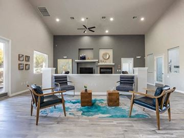 Las Vegas apartment for rent - a living room with a couch and chairs and a fireplace