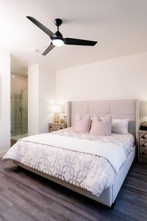 Las Vegas apartment for rent - A bedroom with a large bed and a ceiling fan.