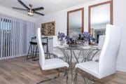 Las Vegas apartment for rent - a dining room with a glass table and white chairs at Evoq Apartment Homes, Las Vegas, 89169  
