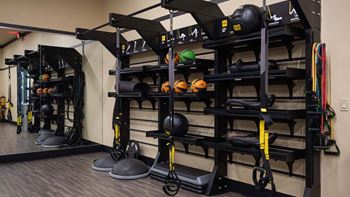 Spacious fitness center with cardio machines and weights