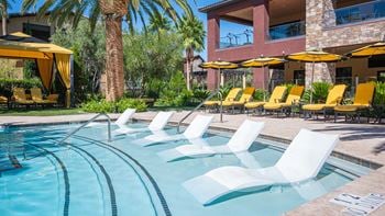Crystal clear swimming pool with sitting area